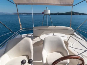 Flybridge seating area on the Jeanneau Prestige 32 motor yacht with open sea view