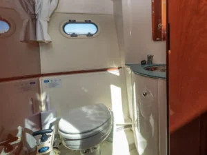 Onboard bathroom with toilet and sink on the Jeanneau Prestige 32 motor yacht