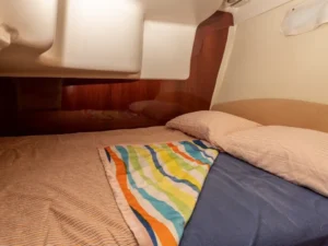 Interior sleeping cabin with double bed on the Jeanneau Prestige 32 motor yacht