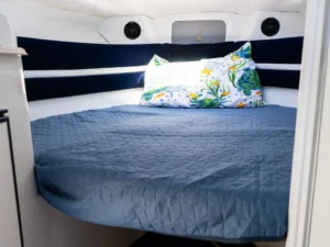 Interior sleeping cabin with double bed on the Saver Riviera 24 motor boat