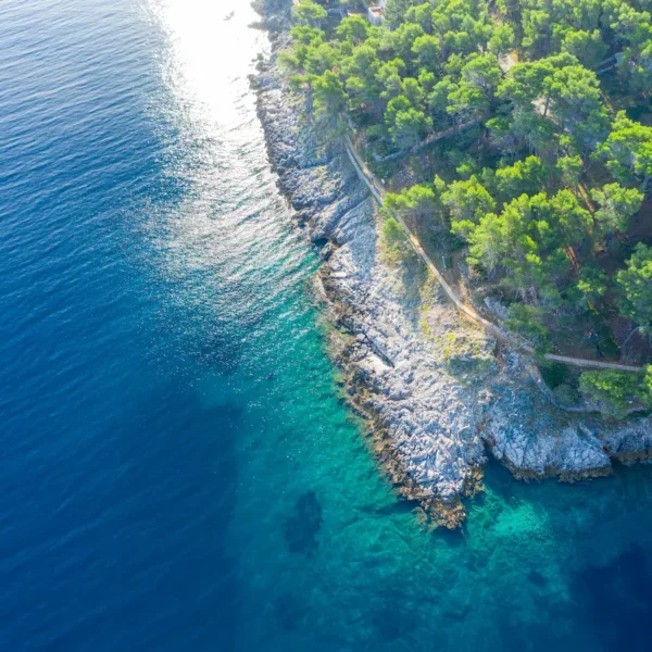 Aerial view of the Adriatic coastline with turquoise water in Croatia