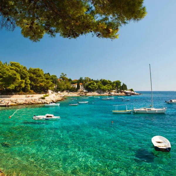 Anchored boats in crystal clear Adriatic Sea on Adriatic Escape tour