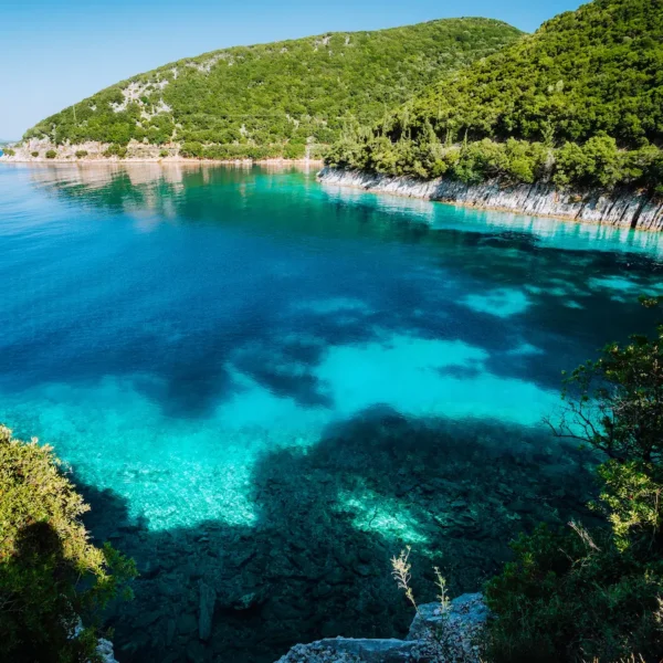 Crystal clear turquoise bay on the Adriatic coast visited during a boat tour